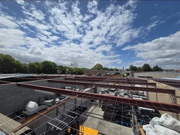 Roof stripped back to purlins and structural framing