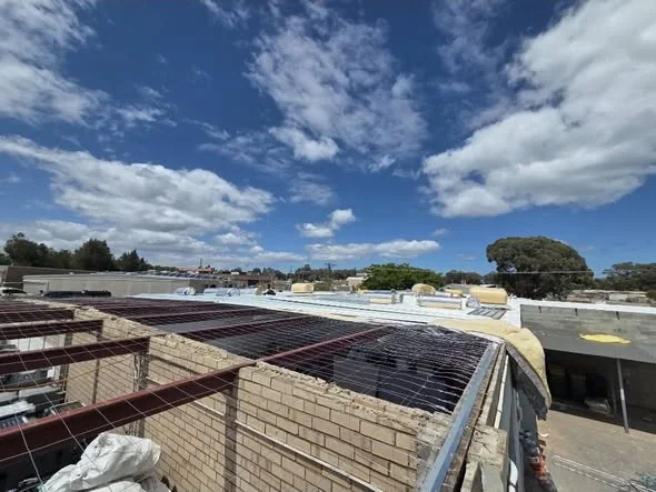Perimeter of the commercial roof during the re-sheeting stage