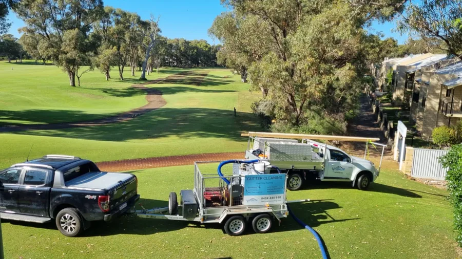 Ute and trailer mounted gutter vacuum tank set up on a commercial grounds job